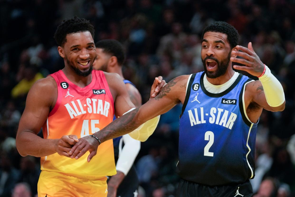 Team LeBron guard Kyrie Irving (2) and Team Giannis guard Donovan Mitchell (45) have some fun during the first half of the NBA basketball All-Star game Sunday, Feb. 19, 2023, in Salt Lake City. (AP Photo/Rick Bowmer)