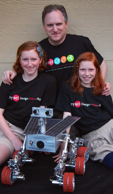 Beatty Robotics' dad and daughter team pose with their Mars rover. (L to R) Camille, Robert and Genevieve have designed and built numerous robots, including this Mars rover commissioned by the New York Hall of Science.