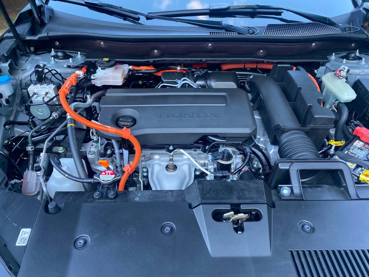 The engine under the hood of a 2025 Honda CR-V Hybrid SUV.