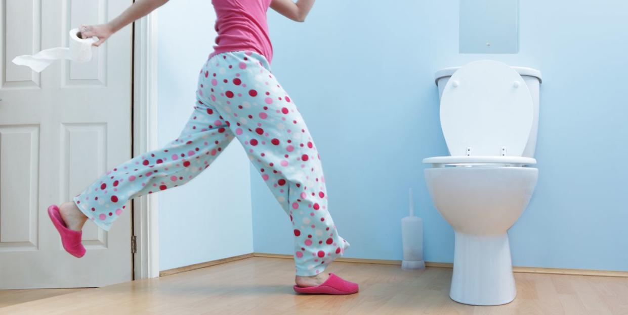 woman running to toilet in night clothes