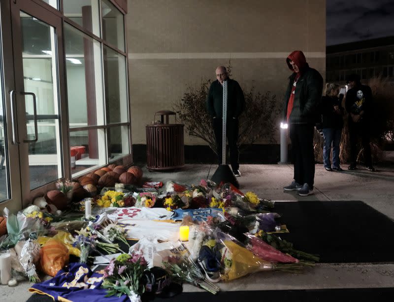 Mourners gather outside of Bryant Gymnasium