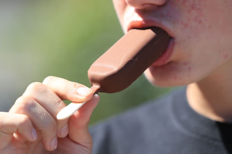 A man eats an Magnum ice cream as a new survey from YouGov has revealed most Britons believe a Magnum is not an ice lolly. PA Photo. Picture date: Friday August 7, 2020. More than one in four Britons named a Magnum as their favourite ice lolly in a previous YouGov poll two years ago. See PA story SOCIAL Magnums. Photo credit should read: Mike Egerton/PA Wire