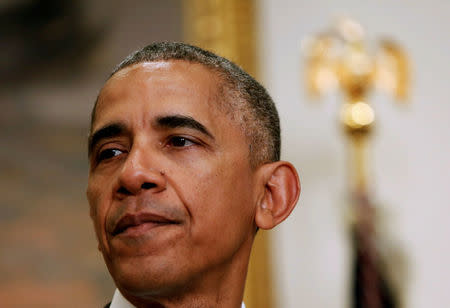 U.S. President Barack Obama, surrounded by U.S. Secretary of Defense Ash Carter (not pictured) and the Chairman of the Joint Chiefs of Staff USMC General Joseph Dunford, Jr., (not pictured) delivers a statement from the Roosevelt Room on Afghanistan at the White House in Washington U.S. July 6, 2016. JREUTERS/Gary Cameron