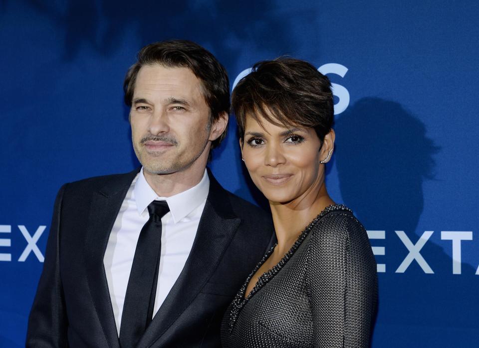 Cast member Halle Berry and husband Olivier Martinez pose at premiere of TV series "Extant" in Los Angeles