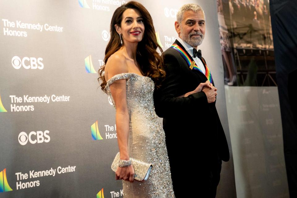 George Clooney, seen here with wife Amal Clooney at the Kennedy Center Honors last year, is among a number of high-profile celebrities donating $1 million or more to help striking actors.