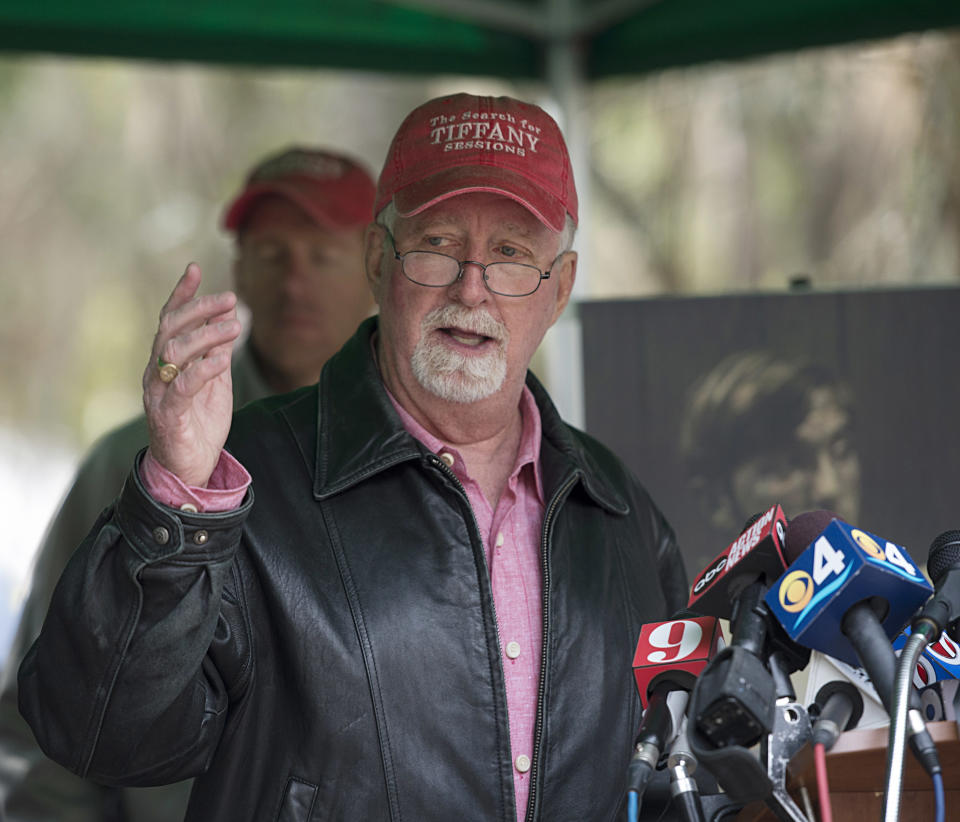 Patrick Sessions, talks to the media Thursday, Feb. 6, 2014, in Gainesville, Fla., when it was announced that a possible suspect has been named in the 1989 disappearance of his daughter Tiffany, a University of Florida student. Authorities have linked her case to Paul Rowles, a serial killer who died in prison last year. (AP Photo/Phil Sandlin)