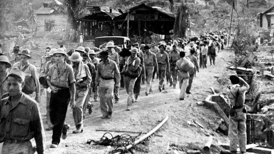 American and Filipino prisoners of war captured by the Japanese are shown at the start of the Death March after the surrender of Bataan on April 9 near Mariveles in the Philippines in 1942 during World War II. Starting on April 10 from Mariveles, on the southern end of the Bataan Penisula, 70,000 POWs were force-marched to Camp O'Donnell, a new prison camp 65 miles away. - AP