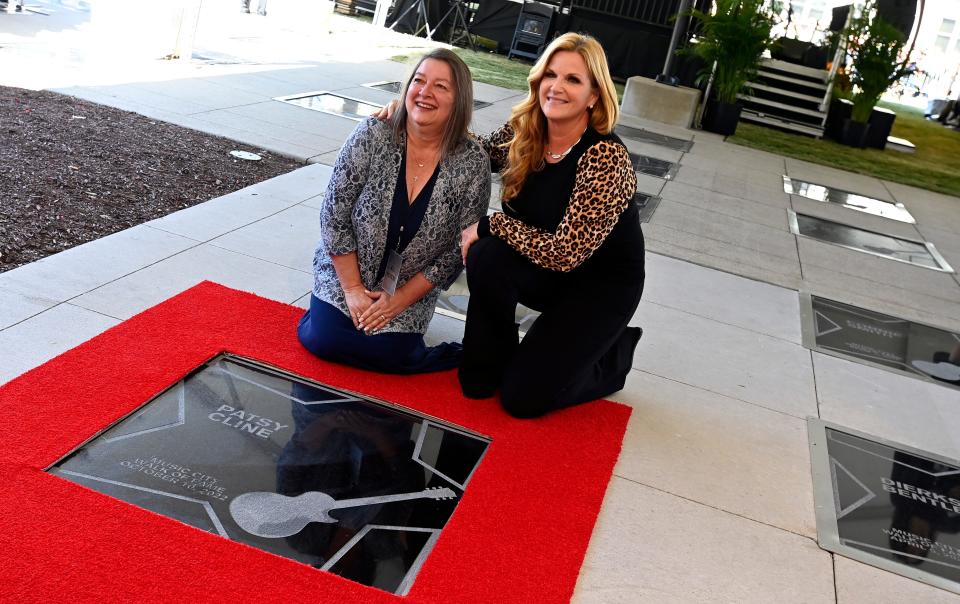 Julie Fudge, daughter of Patsy Cline, and  Trisha Yearwood pose for a photograph her mother’s Walk of Fame star during the Music City Walk of Fame Induction Ceremony Monday, Oct. 10, 2022, in Nashville, Tenn. 