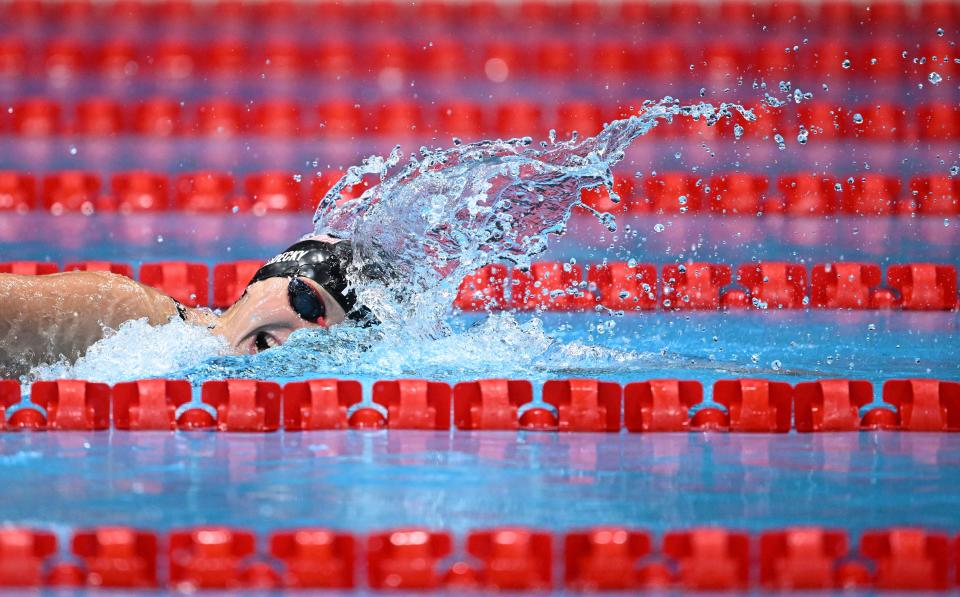 <p>USA's Katie Ledecky competes in the final of the women's 1500m freestyle swimming event during the Tokyo 2020 Olympic Games at the Tokyo Aquatics Centre in Tokyo on July 28, 2021. (Photo by Jonathan NACKSTRAND / AFP)</p> 