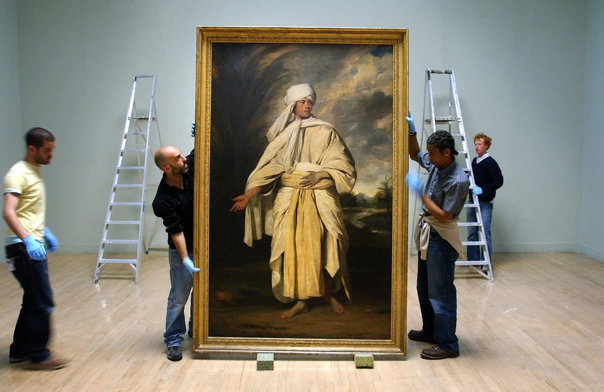 Joshua Reynolds 'Portrait of Omai' is moved before hanging at Tate Britain. (PA)