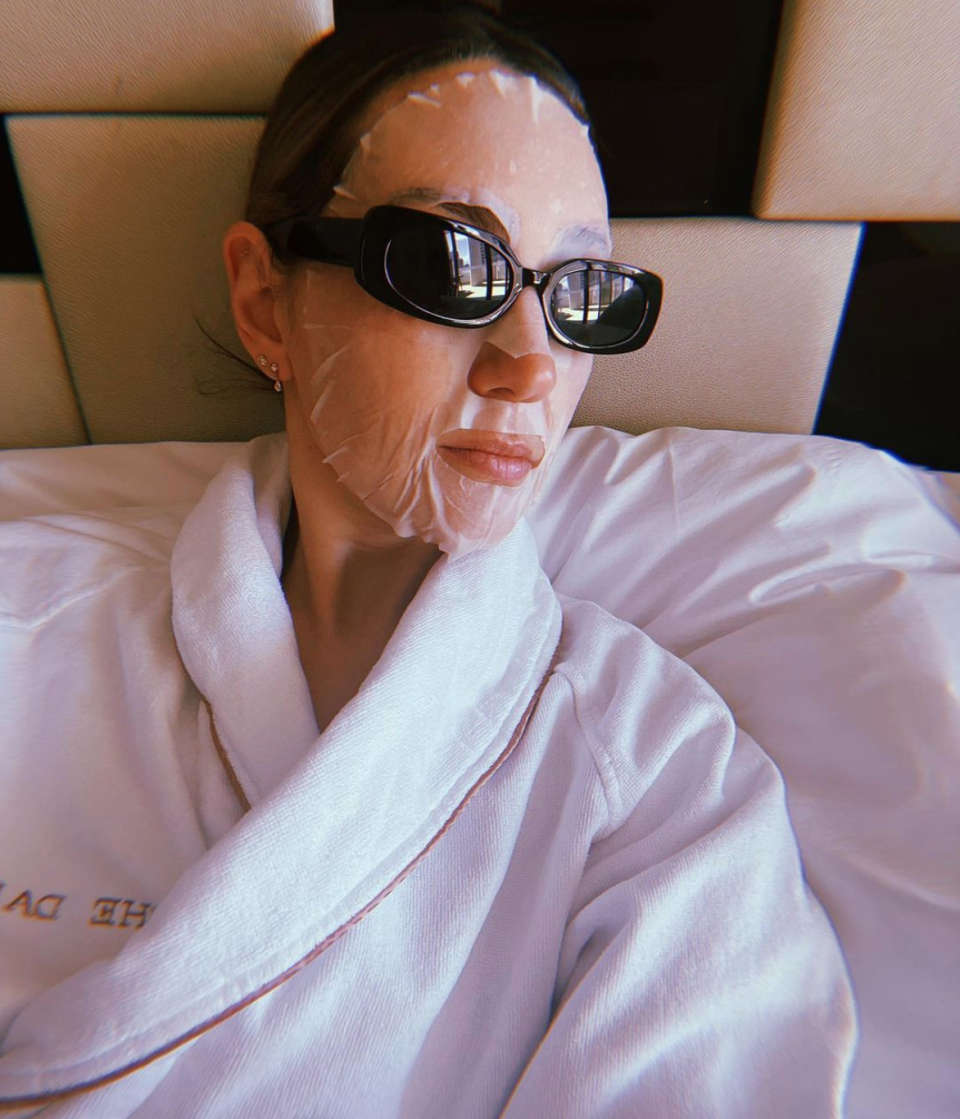 Zoe Foster Blake in a bath robe and sheet mask