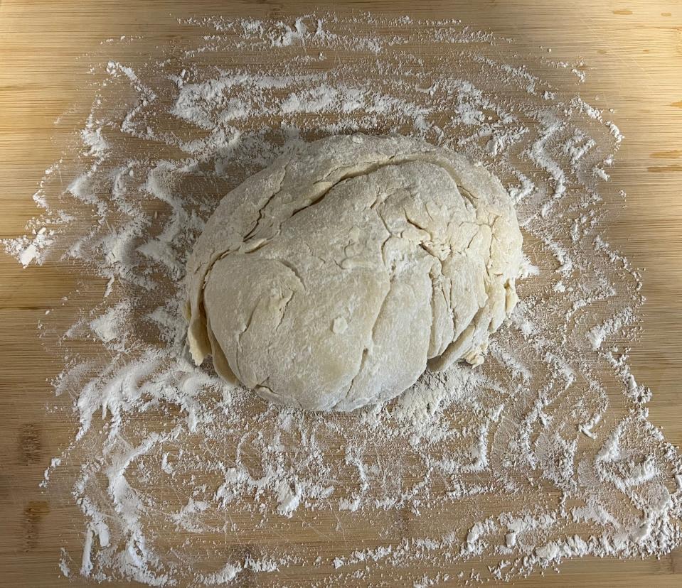 Add the dough to a floured surface.