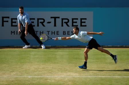 Tennis - ATP 500 - Fever-Tree Championships - The Queen's Club, London, Britain - June 21, 2018 Bulgaria's Grigor Dimitrov in action during his second round match against Serbia's Novak Djokovic Action Images via Reuters/Tony O'Brien