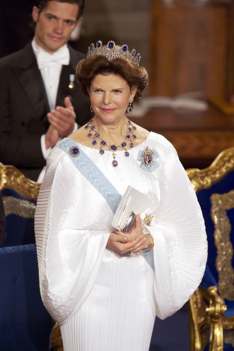 <p>Queen Silvia looked stunning in a white gown and sapphire jewelry at the Nobel Prize Ceremony in Stockholm. </p>