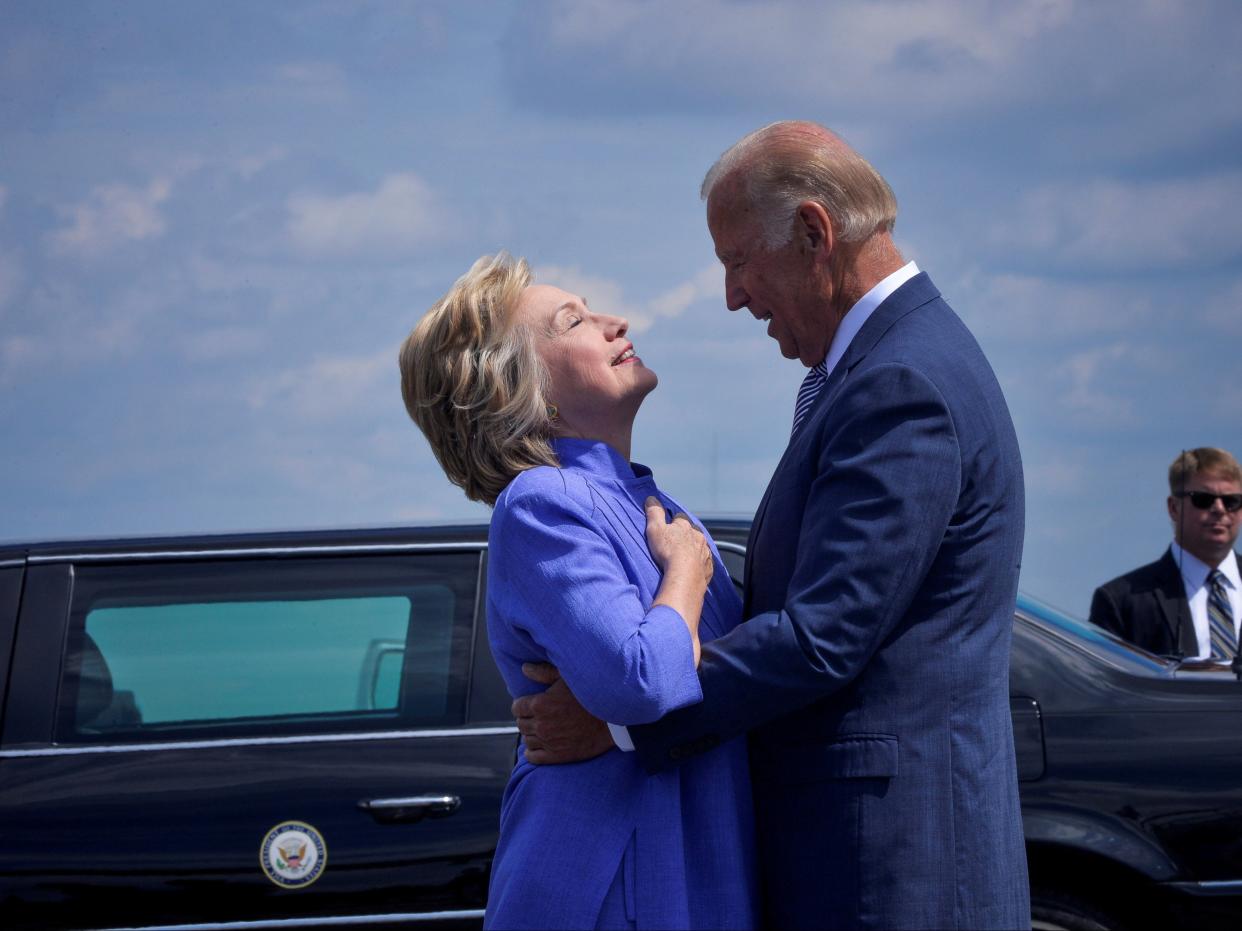 Democratic presidential nominee Hillary Clinton welcomes Vice President Joe Biden as he disembarks from Air Force Two for a joint campaign event in Scranton, Pennsylvania, on 15 August 2016 ((Reuters))