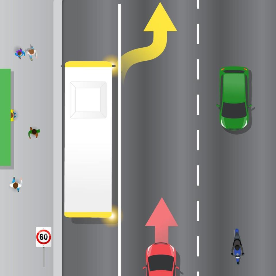 A bus is pictured indicating into oncoming traffic.
