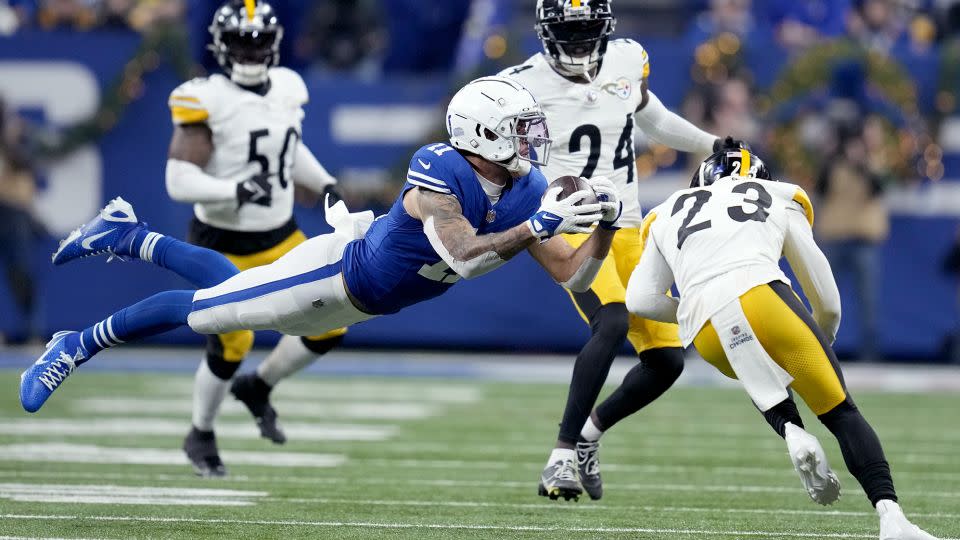 Indianapolis Colts wide receiver Michael Pittman Jr. (11) catches a pass before being hit by Kazee (23). - Michael Conroy/AP