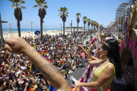 People participate in the annual Pride Parade, in Tel Aviv, Israel, Friday, June 25, 2021. Thousands of people attended the parade on Friday in one of the largest public gatherings held in Israel since the onset of the coronavirus pandemic. (AP Photo/Ariel Schalit)