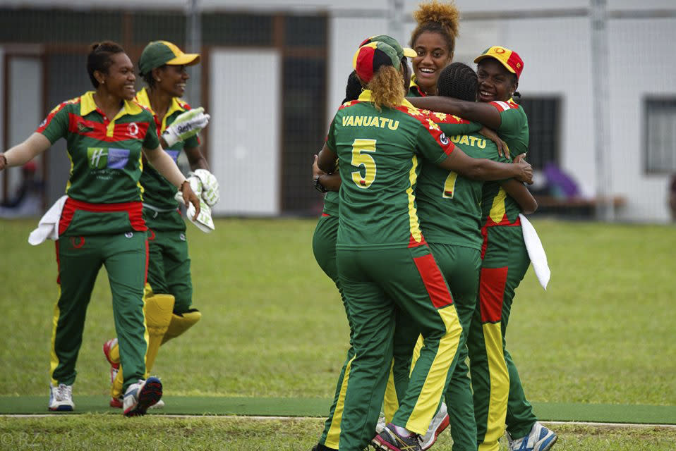 In this May, 2019, photo provided by the Vanuatu Cricket Association players celebrate during a women's cricket match in Port Vila, Vanuatu. The tropical island in the South Pacific is very likely to be the only venue in the world hosting a competitive cricket final on Saturday, as most international sport remains shuttered around the globe. (Ron Zwiers/Vanuatu Cricket Association via AP)