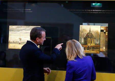 Museum director Axel Ruger and Dutch Minister of Education, Culture and Science Jet Bussemaker reveal two recovered paintings by Vincent van Gogh, which were stolen from the museum in 2002, at the van Gogh Museum in Amsterdam, Netherlands March 21, 2017. REUTERS/Michael Kooren