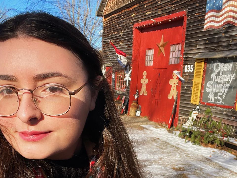 the author in front of the christmas barn