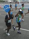 When the tiredness sets in, two runners remind those around them, "You can do it!" (Photo by Saiful and Mohktar)