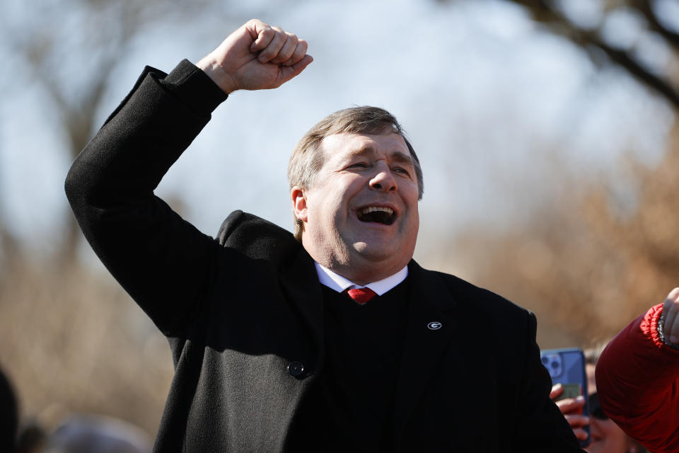 Georgia head coach Kirby Smart cheers with the crowd during a parade celebrating the Bulldog's second consecutive NCAA college football national championship, Saturday, Jan. 14, 2023, in Athens, Ga. (AP Photo/Alex Slitz)