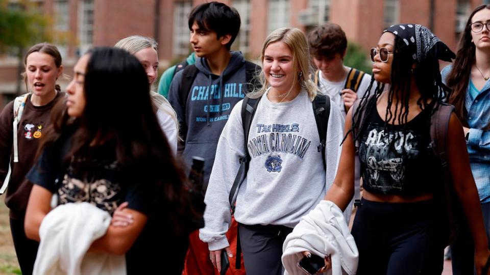 People walk through the campus of University of North Carolina at Chapel Hill on Oct. 31, 2022.