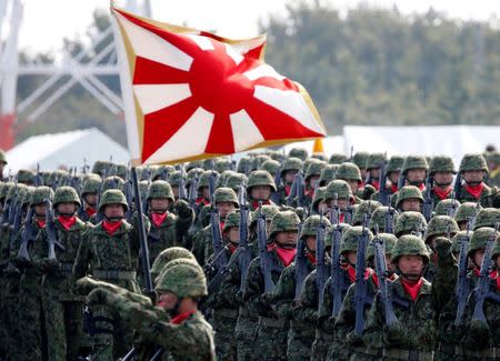FILE PHOTO:Members of Japan's Self-Defence Forces' infantry unit march during the annual SDF ceremony at Asaka Base, Japan, October 23, 2016. REUTERS/Kim Kyung-Hoon/File Photo