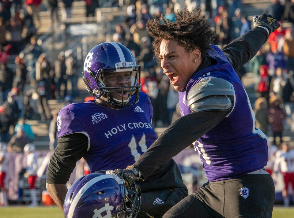 Holy Cross wide receiver Jalen Coker, right, celebrates his game-winning touchdown catch with teammate Byron Shipman last week against Sacred Heart.