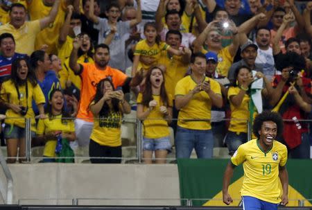 Willian of Brazil celebrates his goal against Venezuela during their 2018 World Cup qualifying soccer match in Fortaleza, Brazil, October 13, 2015. REUTERS/Paulo Whitaker