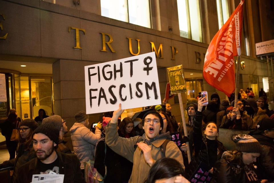 Activists gather in front of the Trump Building during the Stand Against Trump rally and march on 20 January 2017 in New York City (Getty Images)