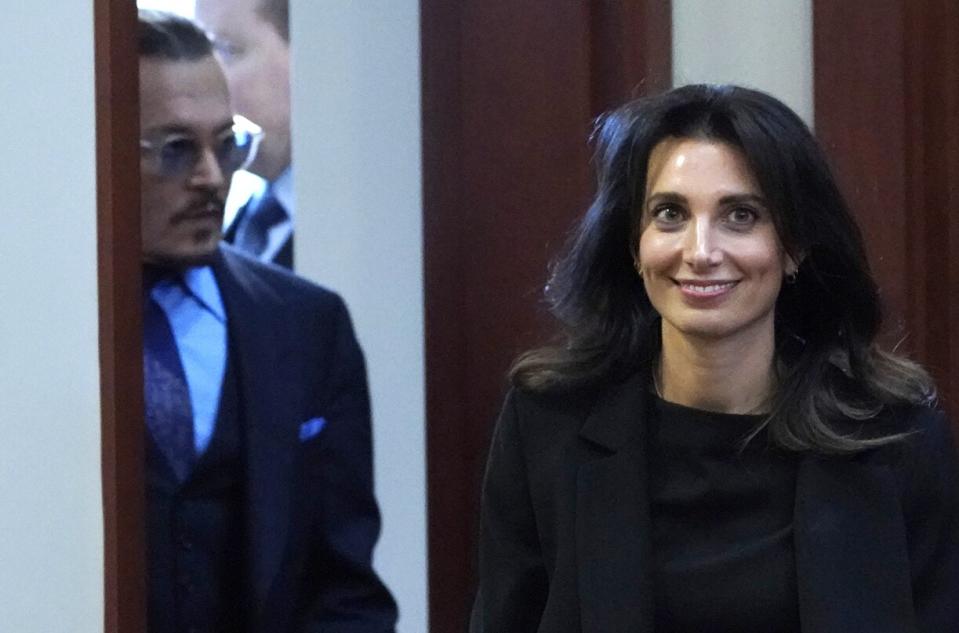 Joelle Rich, of Schillings in London, right, walks into courtroom along with actor Johnny Depp after a break at the Fairfax County Circuit Courthouse in Fairfax, Va., . Depp sued his ex-wife Amber Heard for libel in Fairfax County Circuit Court after she wrote an op-ed piece in The Washington Post in 2018 referring to herself as a "public figure representing domestic abuse Depp Heard Lawsuit, Fairfax, United States - 02 May 2022