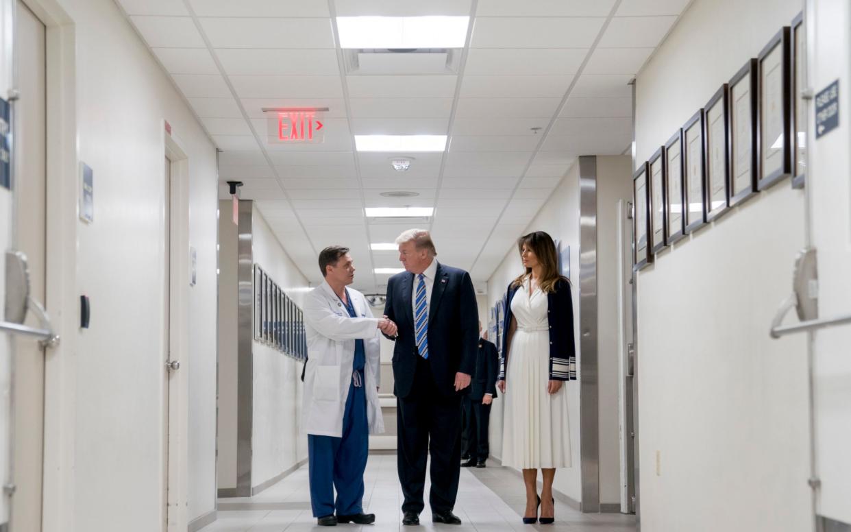 Donald Trump and Melania, the first lady, thank Igor Nichiporenko at Broward Health North hospital where shooting survivors are being treated  - AP