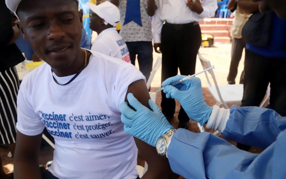  A WHO worker administers a vaccine against Ebola in the city of Mbandaka in Democratic Republic of Congo - REUTERS