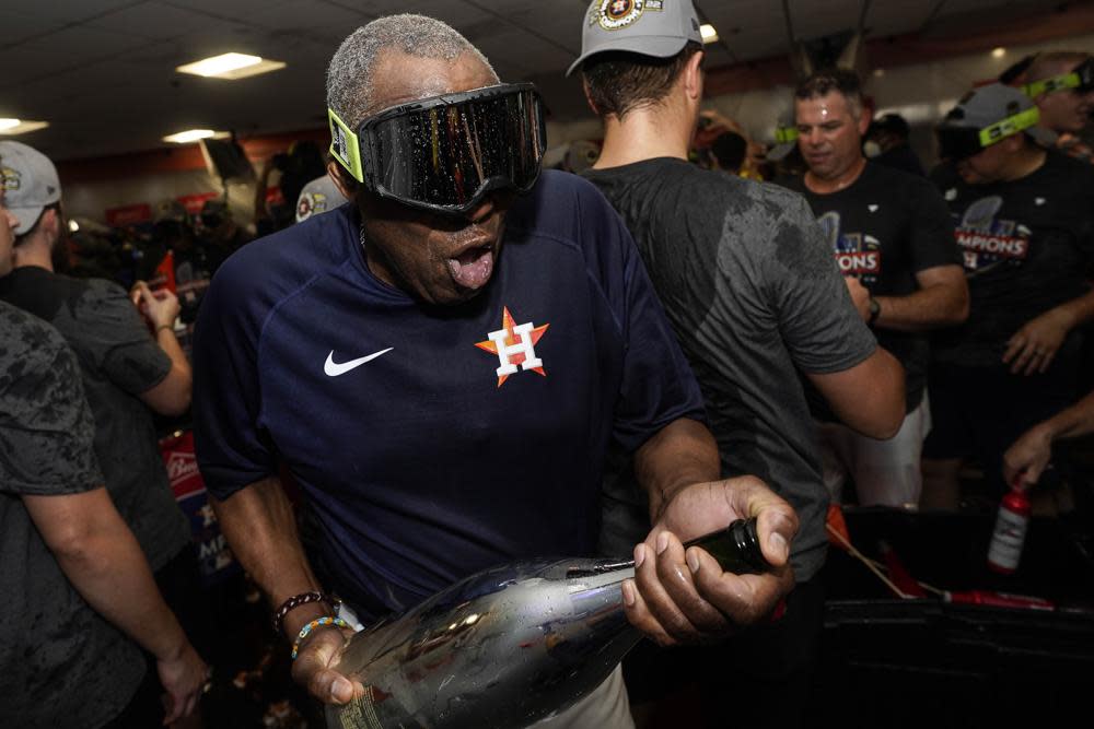 Houston Astros manager Dusty Baker Jr. celebrates in the locker room after their 4-1 World Series win against the Philadelphia Phillies in Game 6 on Saturday, Nov. 5, 2022, in Houston. (AP Photo/David J. Phillip)