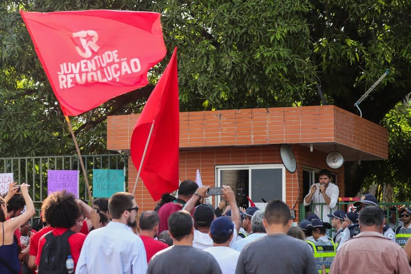 A man addresses supporters of Venezuela's President Nicolas Maduro as they gather in front of the Venezuelan embassy in Brasilia