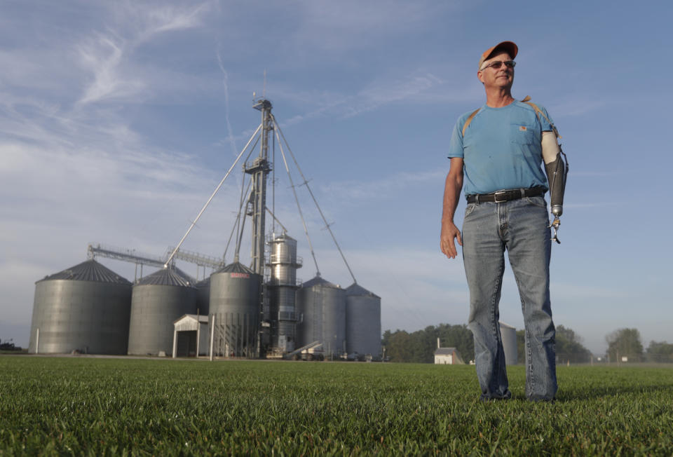 Jack Maloney poses in front of the grain bins on his Little Ireland Farms in Brownsburg, Ind., Wednesday, Sept. 12, 2018. Maloney, who farms about 2,000 acres in Hendricks Count, said the aid for farmers is "a nice gesture" but what farmers really want is free trade, not government handouts. American farmers will soon begin getting checks from the government as part of a billion-dollar bailout to help those experiencing financial strain from President Donald Trump’s trade disputes with China(AP Photo/Michael Conroy)