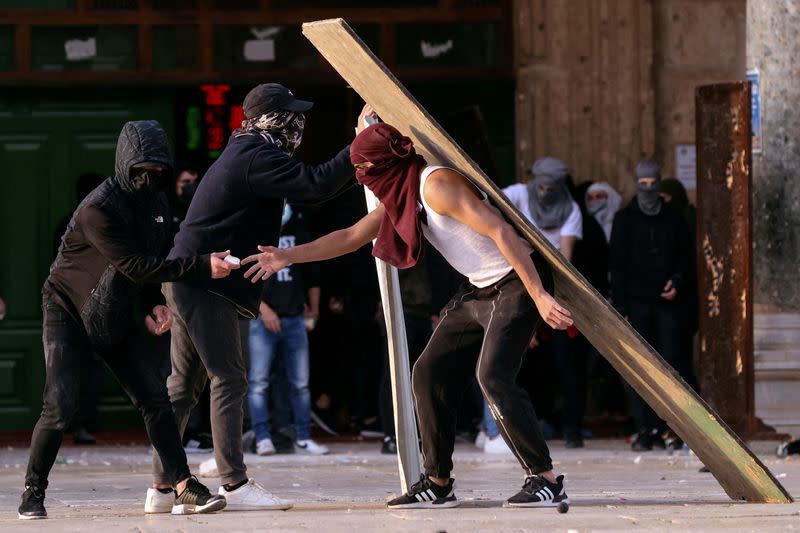 Palestinian protestors clash with Israeli security forces at the compound that houses Al-Aqsa Mosque, known to Muslims as Noble Sanctuary and to Jews as Temple Mount, in Jerusalem's Old City