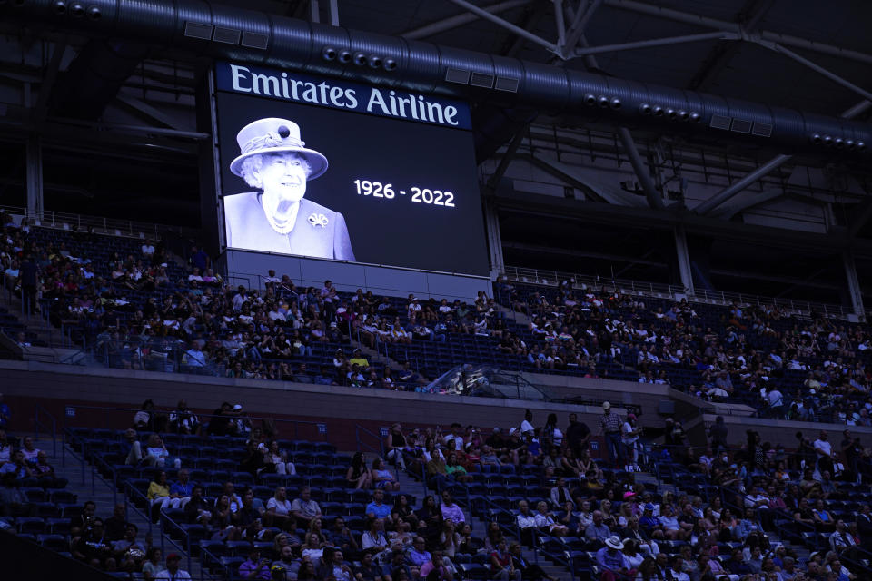 A moment of silence is observed for Queen Elizabeth II ahead of a match between Caroline Garcia, of France, and Ons Jabeur, of Tunisia, during the semifinals of the U.S. Open tennis championships, Thursday, Sept. 8, 2022, in New York. (AP Photo/Matt Rourke)