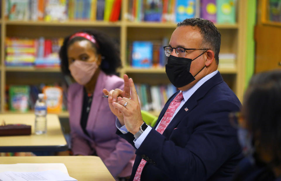 BOSTON - MARCH 30: U.S. Secretary of Education Miguel Cardona meets with Boston school officials and staff, including Acting Mayor Kim Janey, left, to discuss reopening Boston schools, during the continuing coronavirus pandemic in Boston on March 30, 2021. They are in the Joseph P. Tynan Elementary School, in South Boston. (Photo by Pat Greenhouse/The Boston Globe via Getty Images)