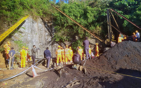 Rescuers work at the site of a coal mine that collapsed in Ksan, in Meghalaya, India, December 23, 2018. REUTERS/Stringer