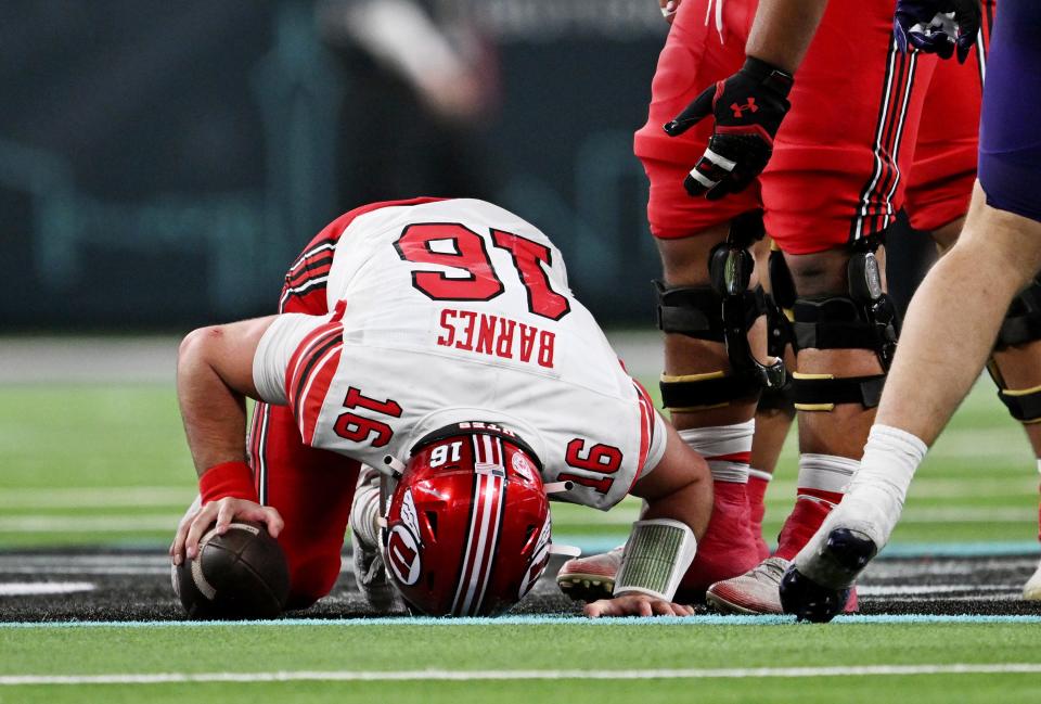 Utah Utes quarterback Bryson Barnes (16) reacts in pain after a hit as Utah and Northwestern play in the SRS Distribution Las Vegas Bowl at Allegiant Stadium on Saturday, Dec. 23, 2023. Northwestern won 14-7. | Scott G Winterton, Deseret News