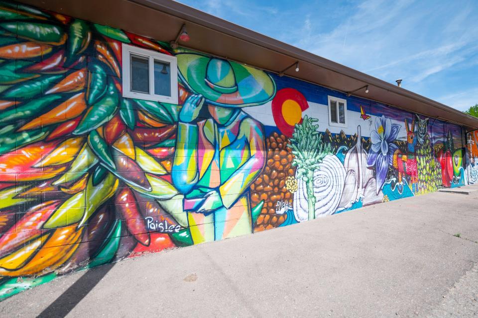 A mural by artist Matte Refic adorns the east side of Julians Restaurant, 2111 W. Northern Ave.
