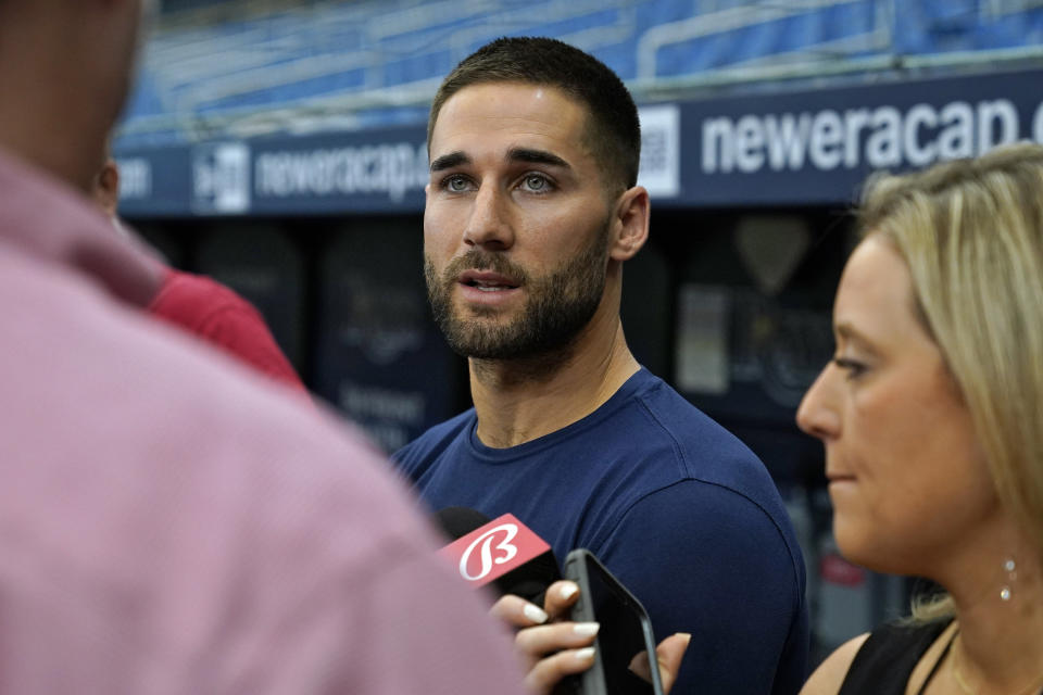 Tampa Bay Rays' Kevin Kiermaier talks to reporters before a baseball game against the Toronto Blue Jays Wednesday, Sept. 22, 2021, in St. Petersburg, Fla. Kiermaier was answering questions about picking up the Blue Jays pitch data card after being tagged out at home plate by catcher Alejandro Kirk during Monday's game. (AP Photo/Chris O'Meara)