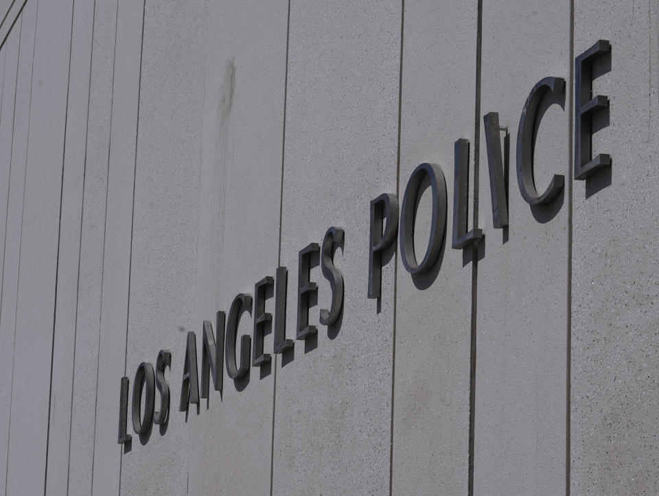 FILE - The Los Angeles Police Department headquarters building is seen in downtown Los Angeles on Friday, July 8, 2022. The Los Angeles police chief and the department's constitutional policing director are under investigation after the names and photographs of undercover officers were released to a technology watchdog group that posted them online, the Los Angeles Times reported. AP Photo/Damian Dovarganes,File)