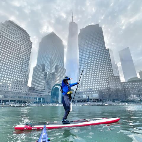 <p>Jack Schlossberg Instagram</p> Jack Schlossberg paddle-boarding off the shore of Manhattan