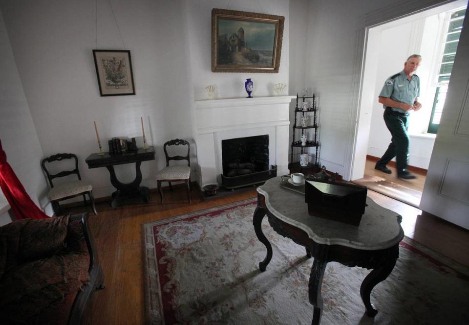 The historic Judah P. Benjamin Confederate Memorial, also known as the Gamble Plantation, is comprised of 18 acres containing the mansion, The Patton House, a visitor’s center, a cistern for gathering rainwater and several areas of interest. This is the parlor, one of 10 rooms in the mansion which has no electricity, as park ranger Wayne Godwin walks past the doorway.