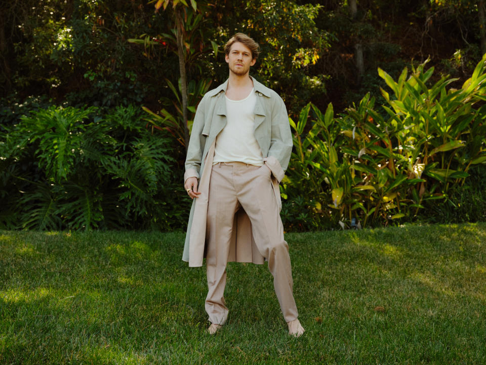 Fendi’s suede trenchcoat over Tom Ford’s viscose tank top; Brioni’s wool and silk blend pants. David Yurman Ring. - Credit: Brad Torchia/WWD