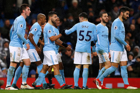 Soccer Football - Premier League - Manchester City vs West Bromwich Albion - Etihad Stadium, Manchester, Britain - January 31, 2018 Manchester City's Sergio Aguero celebrates with team mates after scoring their third goal Action Images via Reuters/Jason Cairnduff